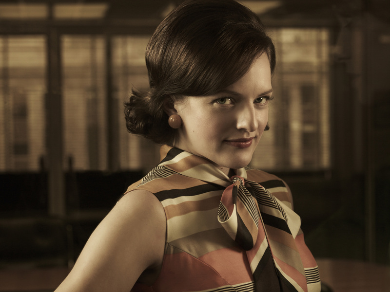Peggy from mad men wearing a 1960s pussy bow blouse mid century modern fashion